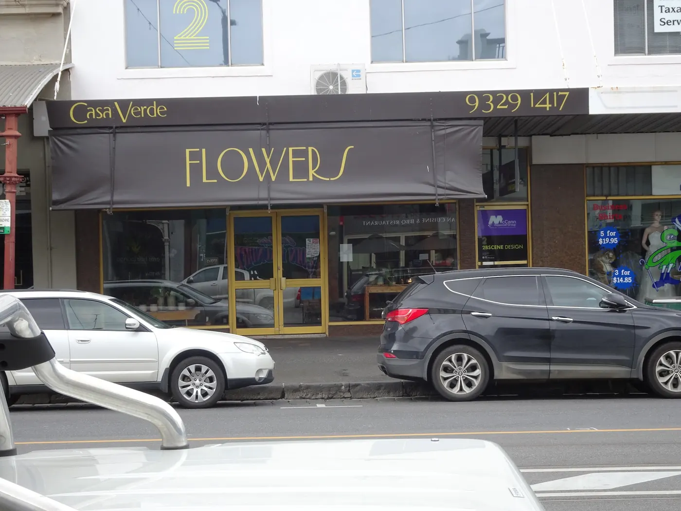 The Casa Verde awning on Errol Street with gold FLOWERS lettering and the phone number 9329 1417